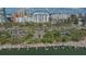 Scenic aerial view showcases waterfront apartments, boat docks, and lush landscaping for tranquil bayside living at 101 S Gulfstream Ave # 4J, Sarasota, FL 34236