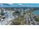 Gorgeous aerial view of the building with a pool and the beautiful views of the downtown area and waterfront at 101 S Gulfstream Ave # 4J, Sarasota, FL 34236