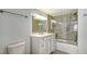 Modern bathroom featuring a tiled shower-tub combination and a vanity with a white countertop at 101 S Gulfstream Ave # 4J, Sarasota, FL 34236