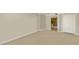 Spacious room with a glimpse into the modern bathroom featuring a vanity with natural wood finish at 101 S Gulfstream Ave # 4J, Sarasota, FL 34236