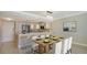 Dining room with kitchen bar, table and chairs featuring a modern style in an open concept layout at 101 S Gulfstream Ave # 4J, Sarasota, FL 34236