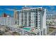 Exterior full view of a high rise building with a pool and lounge area on the top level at 101 S Gulfstream Ave # 4J, Sarasota, FL 34236