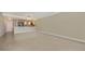 Open living room featuring tile floors and an eat-in kitchen with modern appliances at 101 S Gulfstream Ave # 4J, Sarasota, FL 34236