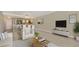 Open concept living area with view of kitchen, breakfast bar, and seating area at 101 S Gulfstream Ave # 4J, Sarasota, FL 34236