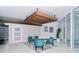 Modern lobby seating area featuring stylish turquoise seating, accent rug, and bright entryway at 101 S Gulfstream Ave # 4J, Sarasota, FL 34236