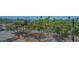 The parking lot has lush landscaping, mature trees, and is near the water at 101 S Gulfstream Ave # 4J, Sarasota, FL 34236