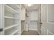 Spacious walk-in closet with custom shelving and storage solutions, and a bonus beverage cooler at 101 S Gulfstream Ave # 4J, Sarasota, FL 34236