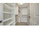 Spacious walk-in closet with custom shelving and ample storage space at 101 S Gulfstream Ave # 4J, Sarasota, FL 34236