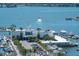 Picturesque waterfront restaurant with boats docked nearby and palm tree lined entrance at 101 S Gulfstream Ave # 4J, Sarasota, FL 34236
