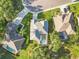 Aerial view of a home with a screened pool area in a mature residential neighborhood at 10306 Palmbrooke Ter, Bradenton, FL 34202