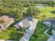 Gorgeous aerial view of home, showing landscaping, attached garage, and fenced pool at 10306 Palmbrooke Ter, Bradenton, FL 34202