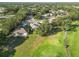 A serene view from above showcases a home nestled beside a lush green golf course at 10306 Palmbrooke Ter, Bradenton, FL 34202
