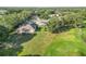 Aerial view of property with screened in pool, trees, and spacious lot at 10306 Palmbrooke Ter, Bradenton, FL 34202