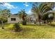 Spacious backyard with a view of the pool and an enclosed patio, perfect for relaxing at 10306 Palmbrooke Ter, Bradenton, FL 34202