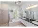 Bathroom boasting a large tub, walk-in shower, and dual sinks under attractive lighting at 10306 Palmbrooke Ter, Bradenton, FL 34202