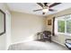 Bedroom featuring neutral carpet, ceiling fan, and natural lighting at 10306 Palmbrooke Ter, Bradenton, FL 34202