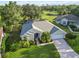 Aerial view showcasing the home's manicured landscaping, well-kept lawn, and attached garage at 10306 Palmbrooke Ter, Bradenton, FL 34202