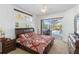 Cozy main bedroom with king bed and sliding glass doors leading to pool area at 10306 Palmbrooke Ter, Bradenton, FL 34202