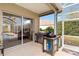 View of the screened-in patio with an outdoor cooking area at 10306 Palmbrooke Ter, Bradenton, FL 34202