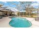 Beautiful screened-in pool with an outdoor kitchen area is great for entertaining and enjoying the outdoors at 10306 Palmbrooke Ter, Bradenton, FL 34202