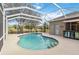 Screened-in pool with steps, surrounded by lush landscaping at 10306 Palmbrooke Ter, Bradenton, FL 34202