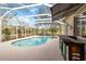 Screened-in pool area with a beautiful view of the backyard at 10306 Palmbrooke Ter, Bradenton, FL 34202