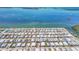 Spacious community with palm trees with an aerial view of waterfront homes on the coastline at 10315 Cortez W Rd # 17F, Bradenton, FL 34210
