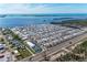 Expansive aerial view of a coastal community with waterfront access, amenities, and stunning ocean views at 10315 Cortez W Rd # 17F, Bradenton, FL 34210
