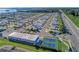 Aerial view of manufactured homes and community shuffleboard and tennis courts at 10315 Cortez W Rd # 17F, Bradenton, FL 34210