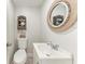 A quaint bathroom features a decorative mirror and a decorative display cabinet at 10315 Cortez W Rd # 17F, Bradenton, FL 34210
