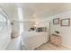 Bright bedroom with a queen bed, white walls, and serene decor creates a relaxing space at 10315 Cortez W Rd # 17F, Bradenton, FL 34210