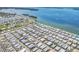 Overhead view of a large waterfront community with palm trees, waterways, and stunning coastal views at 10315 Cortez W Rd # 17F, Bradenton, FL 34210