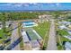 Aerial view of community amenities including pool, shuffle board, and tennis courts at 10315 Cortez W Rd # 17F, Bradenton, FL 34210