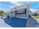 Lovely home featuring a well-kept exterior, an attached carport and colorful flower accents at 10315 Cortez W Rd # 17F, Bradenton, FL 34210