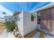 Exterior view featuring a wooden privacy fence and a variety of vegetation at 10315 Cortez W Rd # 17F, Bradenton, FL 34210
