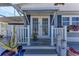 Inviting front entrance with double doors, manicured plants, and colorful flower box at 10315 Cortez W Rd # 17F, Bradenton, FL 34210