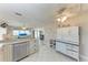 Bright kitchen with stainless steel appliances and an adjacent living area at 10315 Cortez W Rd # 17F, Bradenton, FL 34210