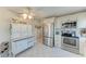 Bright kitchen boasts stainless steel appliances and stylish white cabinetry at 10315 Cortez W Rd # 17F, Bradenton, FL 34210