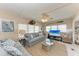 Inviting living room with neutral tones, nautical décor, and abundant natural light at 10315 Cortez W Rd # 17F, Bradenton, FL 34210