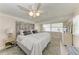 Comfortable bedroom featuring natural light, a decorative headboard, and a soft color palette at 10315 Cortez W Rd # 17F, Bradenton, FL 34210