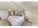 Spacious main bedroom with a decorative headboard, soft color palette, and ample closet space at 10315 Cortez W Rd # 17F, Bradenton, FL 34210
