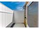 Private outdoor shower with a charming watering can accent and neutral colored mat at 10315 Cortez W Rd # 17F, Bradenton, FL 34210