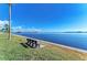 Scenic waterfront view with a bench, perfect for relaxing and enjoying the peaceful surroundings at 10315 Cortez W Rd # 17F, Bradenton, FL 34210