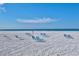 Picturesque beach view with comfortable lounge chairs and calm ocean waters, perfect for relaxation and enjoying the scenery at 1141 W Peppertree Dr # 1141, Sarasota, FL 34242