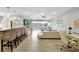 Spacious living area with an open floor plan, stylish furnishings, and inviting coastal decor at 1141 W Peppertree Dr # 1141, Sarasota, FL 34242