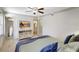 Serene main bedroom featuring a ceiling fan, TV, and connecting bath at 1141 W Peppertree Dr # 1141, Sarasota, FL 34242