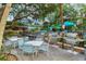 Community poolside grills and tables offer space for outdoor dining and entertainment at 1141 W Peppertree Dr # 1141, Sarasota, FL 34242