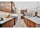 Spacious kitchen features wooden cabinets, stainless steel appliances and marble countertops at 12809 Rainwashed Loop, Parrish, FL 34219