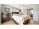 This bedroom features wood-look tile, a ceiling fan and a large window for natural light at 1310 Grand Blvd # 202, Sarasota, FL 34232