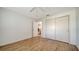 This bedroom features wood-look tile, a ceiling fan, closet and interior door at 1310 Grand Blvd # 202, Sarasota, FL 34232